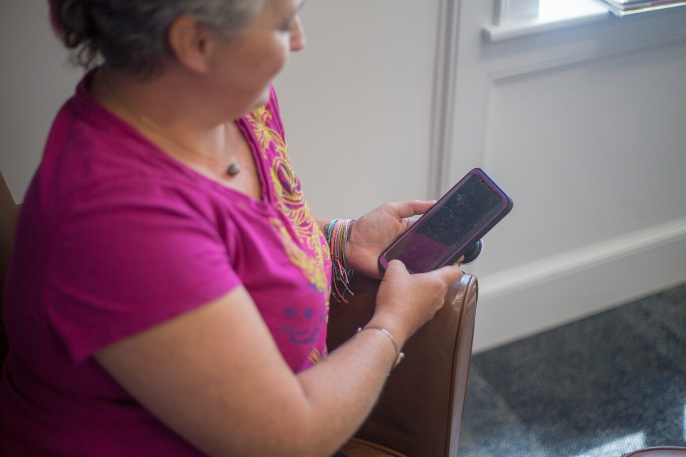 Lady holding mobile phone