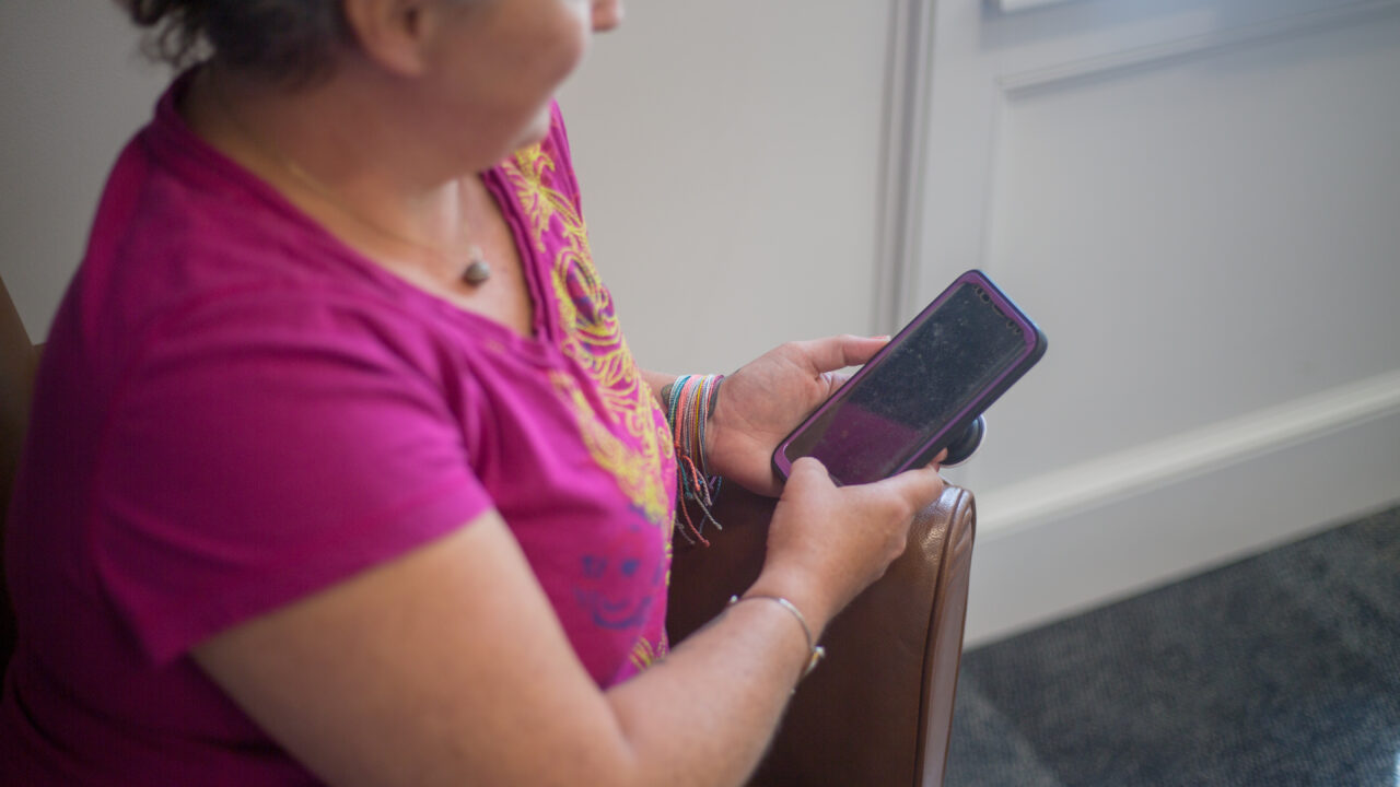 Lady holding mobile phone