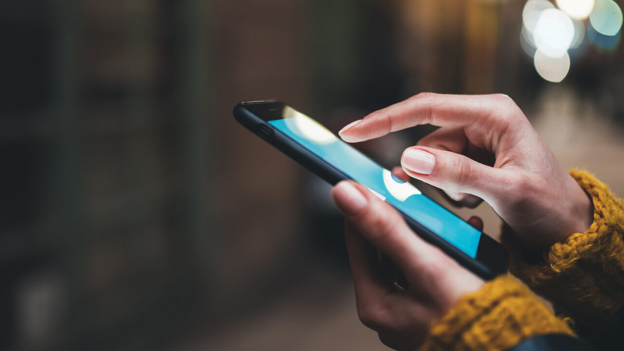 Lady holding a mobile phone