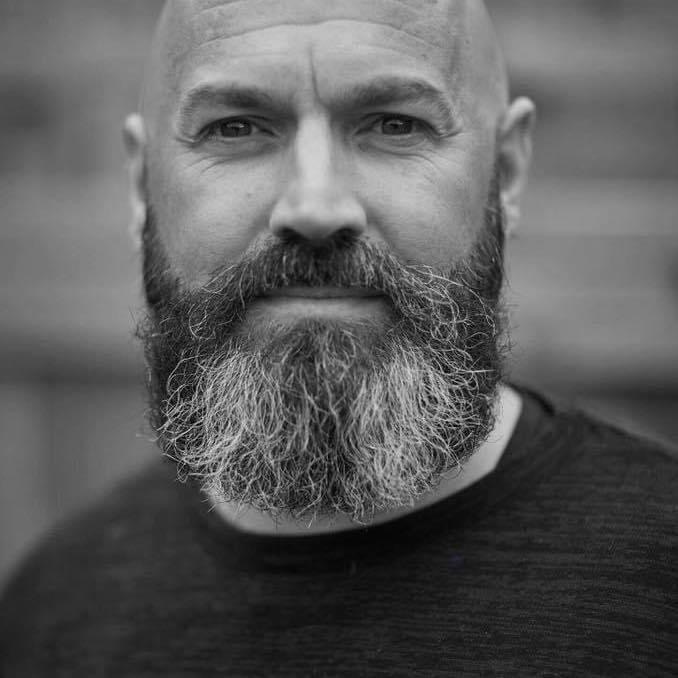 A black and white photo of Dave Steele, The Blind Poet.